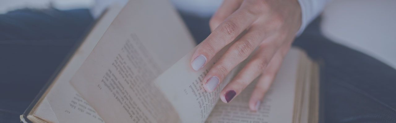 Person Paging through Bible Person Paging through Bible