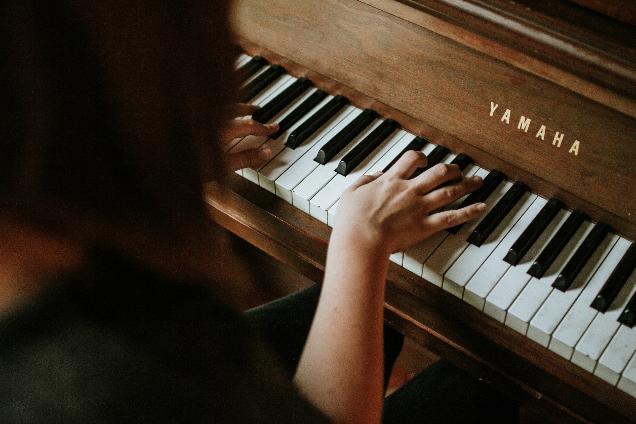 PianoPlaying Person playing a piano